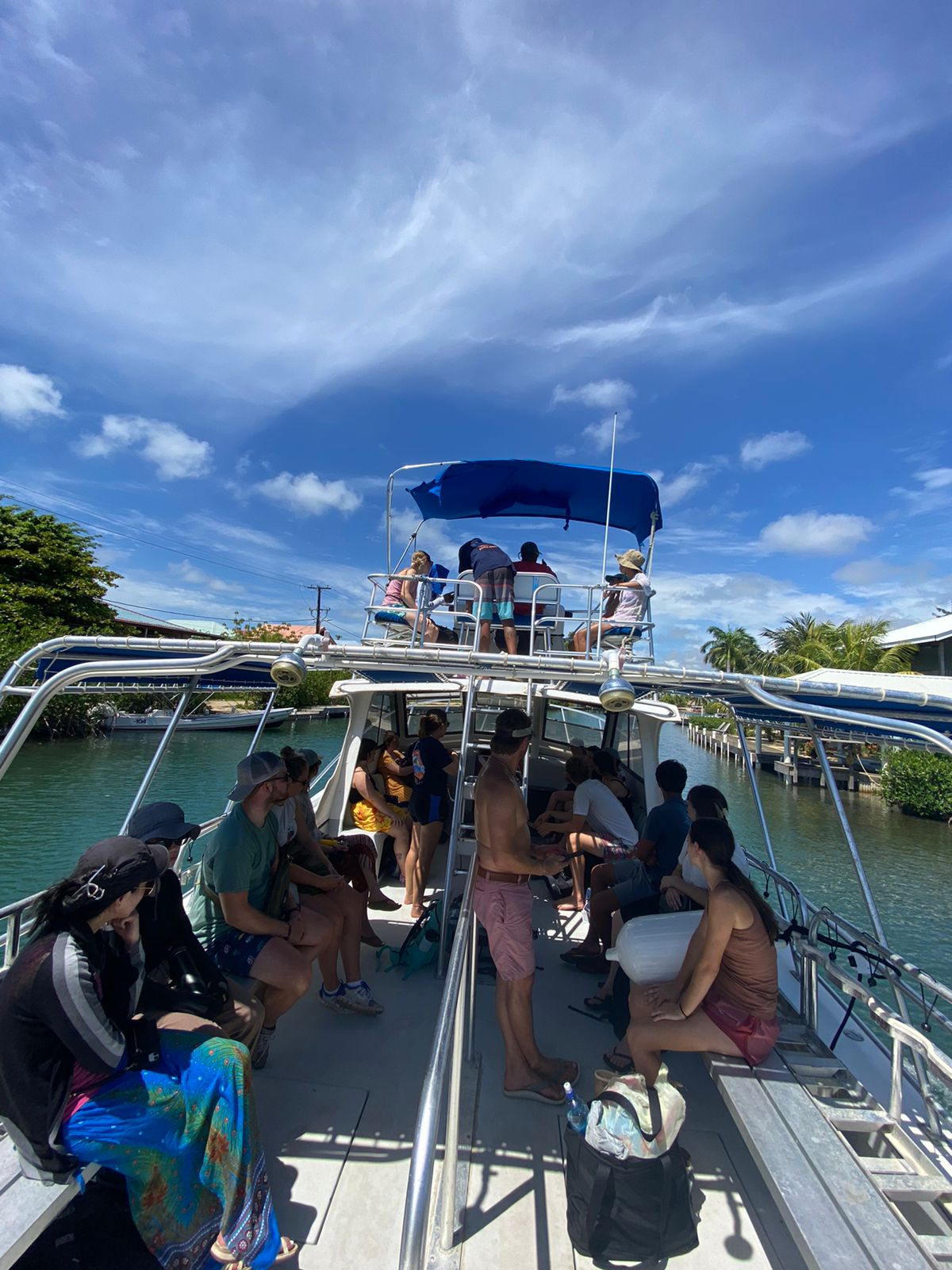 a group of people sitting at a dock