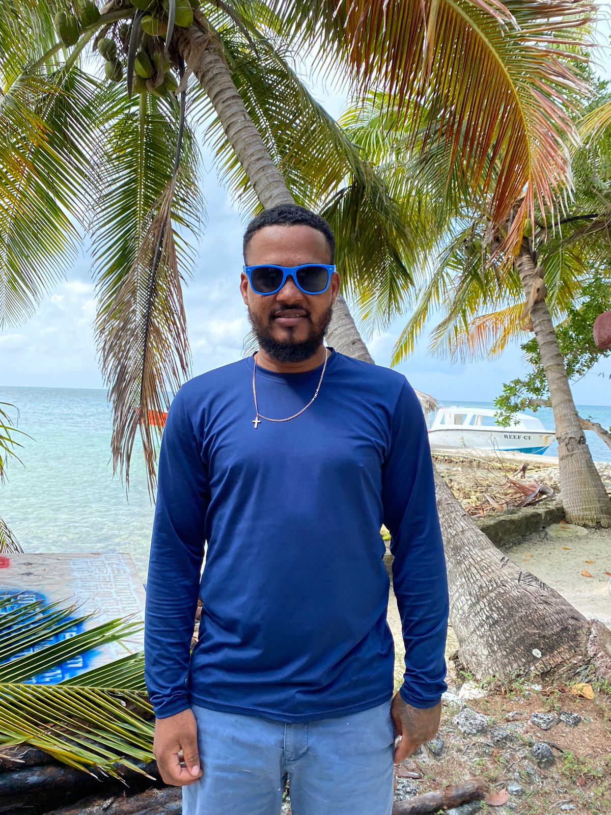 a man standing next to a body of water